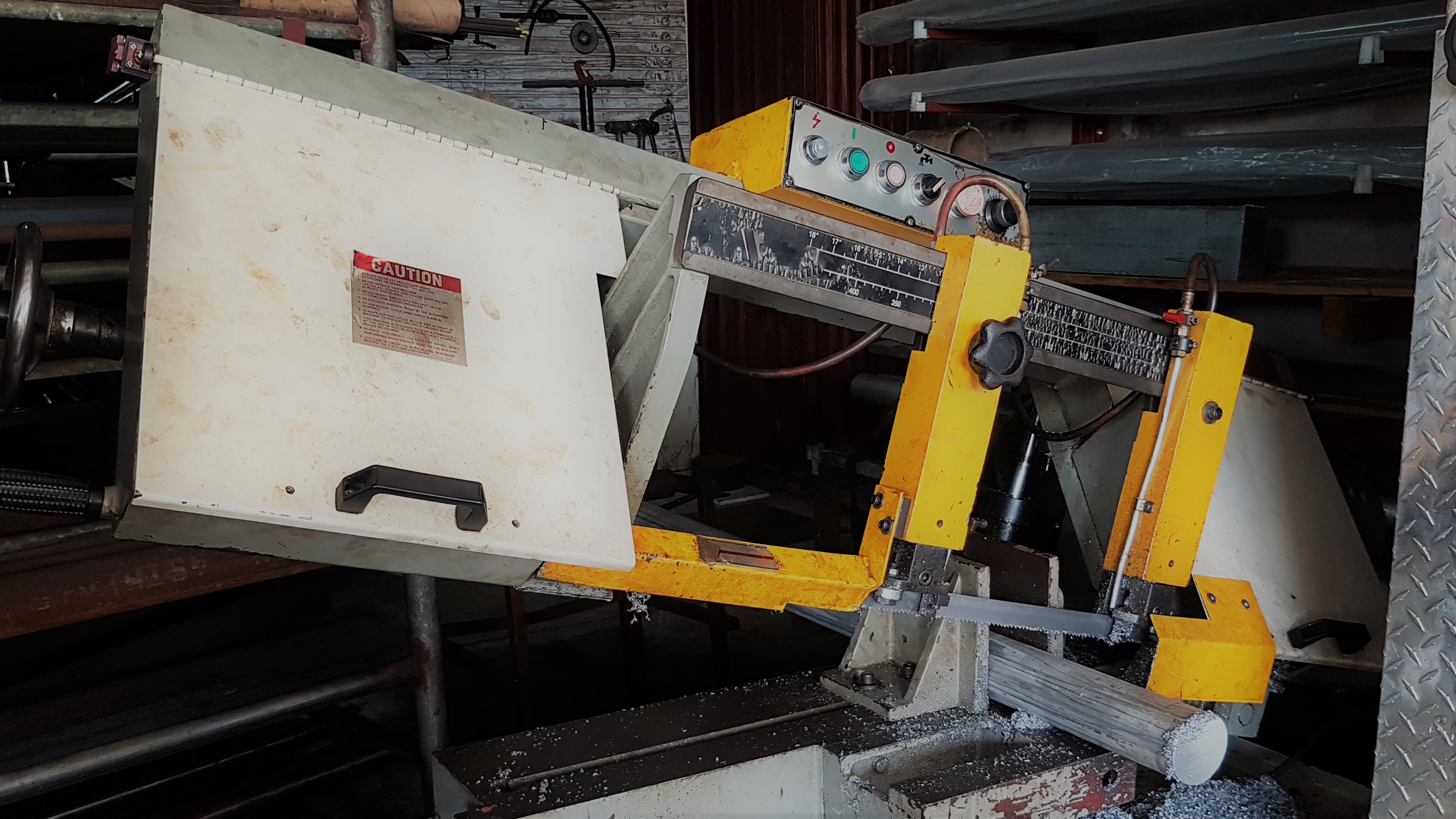 machine cutting a solid metal bar